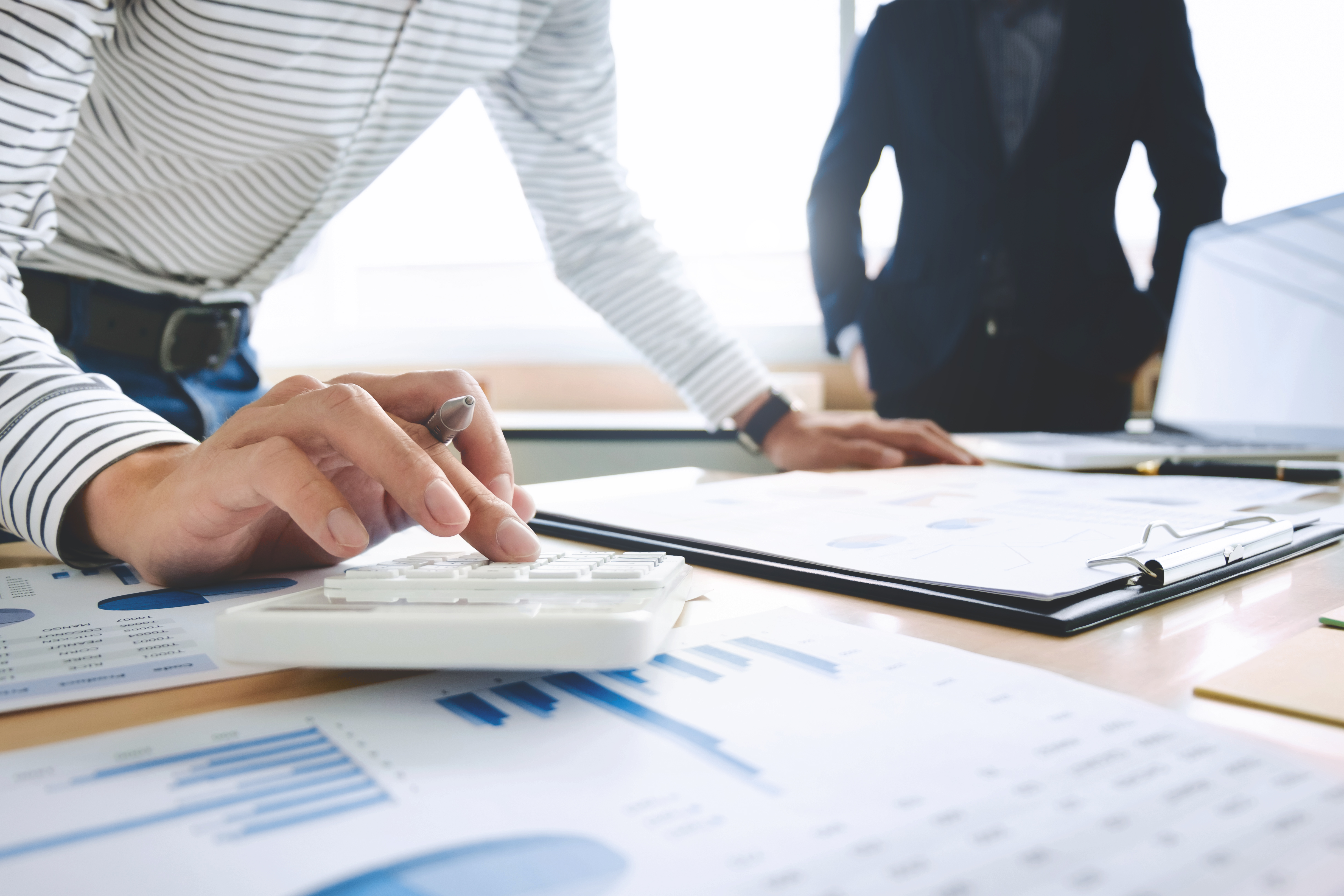 two-business-executives-partner-analysis-data-document-with-acc_p25863